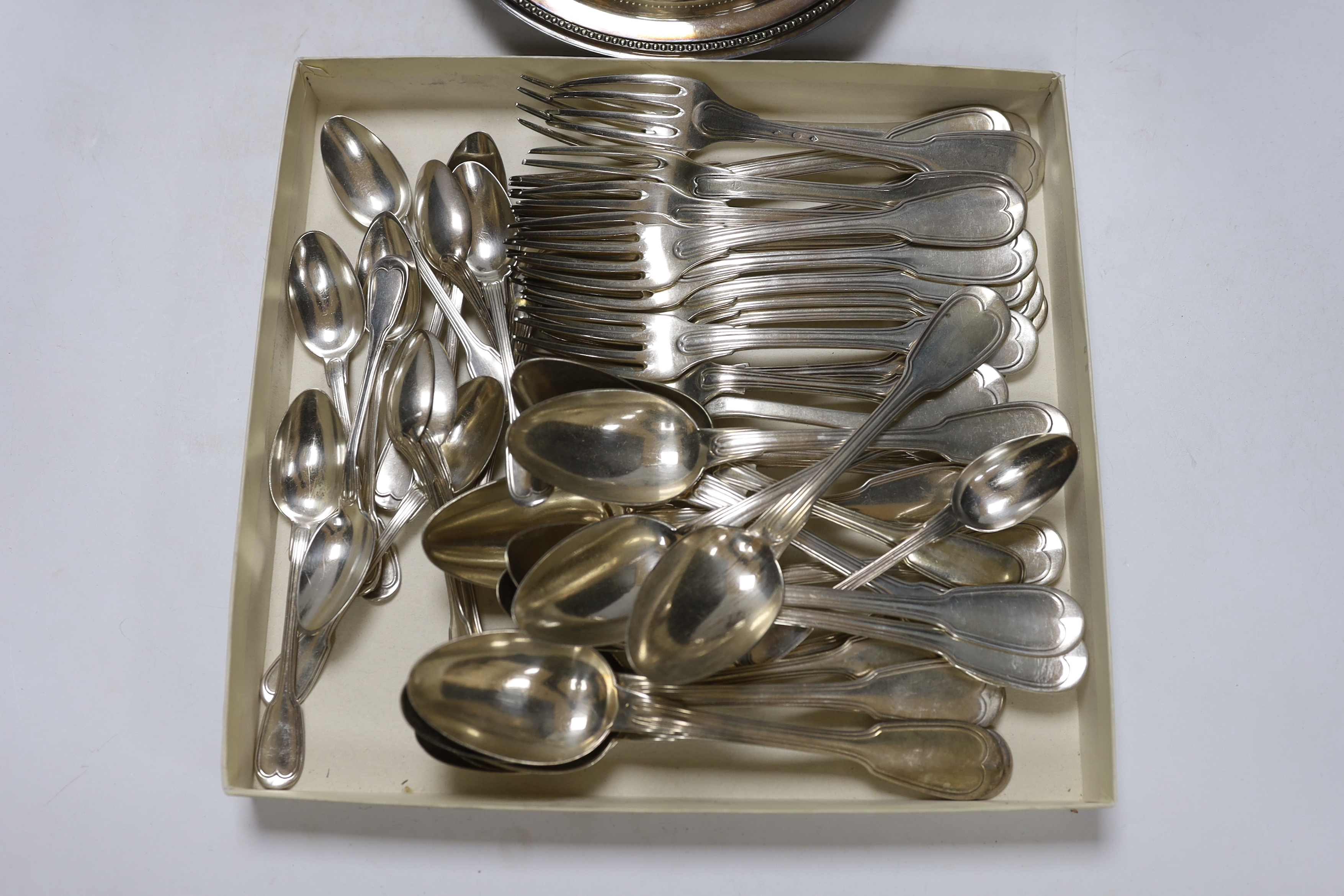 Assorted plated wares including Christofle flatware, coffee pot and three serving dishes.